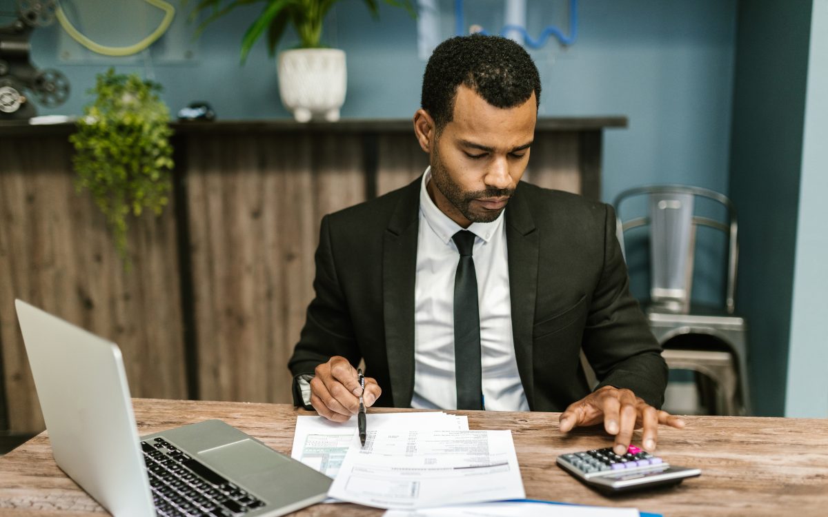 Business official working through cost data